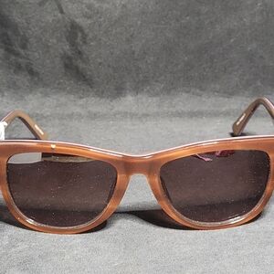 Isaac Mizrahi sunglasses in the IM30202 model, Tan Tortoise colorway.